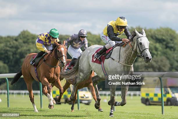 Royston Ffrench riding Snowy Dawn during The ApolloBET Online Casino And Games Handicap at Haydock Park Racecourse on August 4, 2016 in Haydock,...