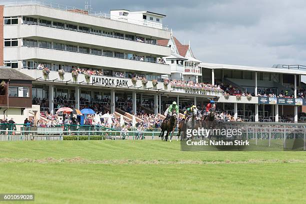 Riders during the ApolloBET Online Casino And Games Handicap at Haydock Park Racecourse on August 4, 2016 in Haydock, England.
