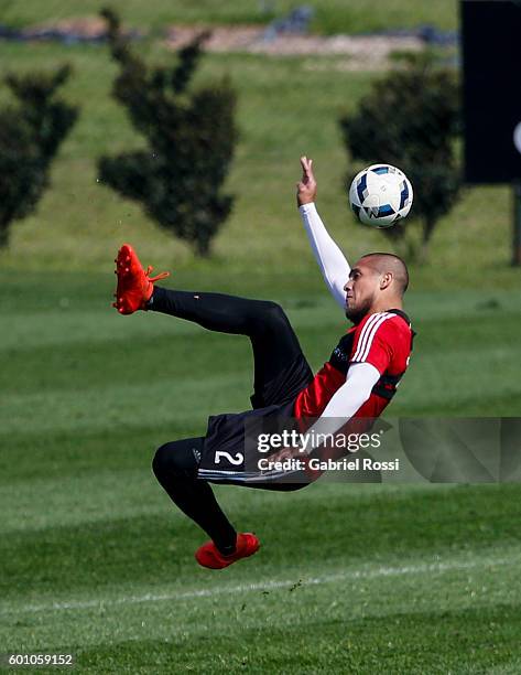 Jonathan Maidana of River Plate kicks the ball during a training session at River Plate's training camp on September 09, 2016 in Ezeiza, Argentina.