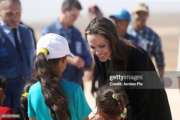 Actress and UNHCR special envoy and Goodwill Ambassador Angelina Jolie greets children during a press conference at Al- Azraq camp for Syrian...