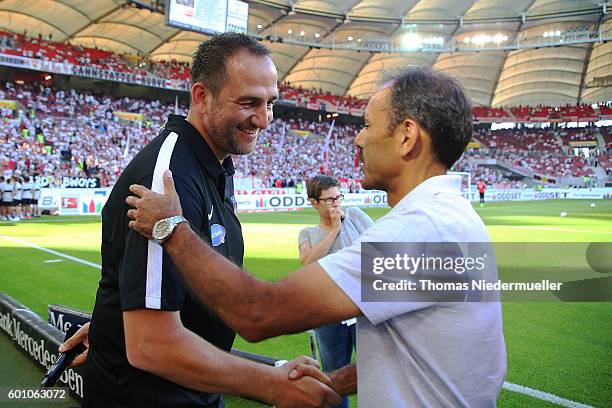 Frank Schmidt , head coach of Heidenheim shakes hands with Joos Luhukay , head coach of Stuttgart prior to the Second Bundesliga match between VfB...