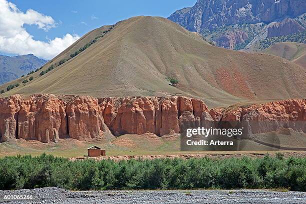 Red sandstone formations in the mountains of the Osh Province, Kyrgyzstan.