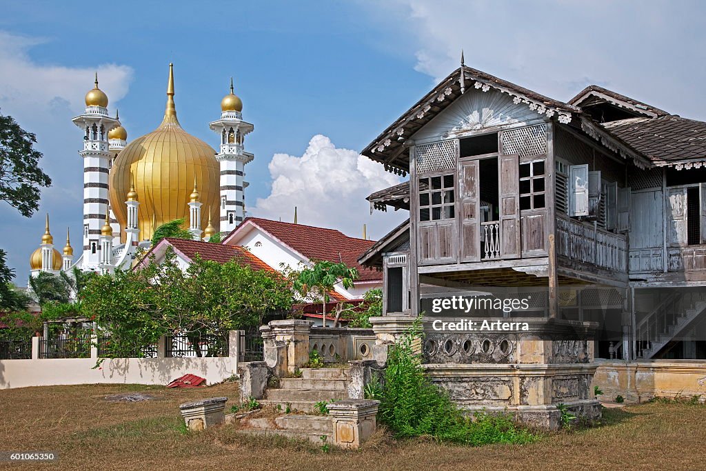 Ubudiah Mosque / Masjid Ubudiah and old traditional Malaysian wooden house on pillars in Kuala Kangsar