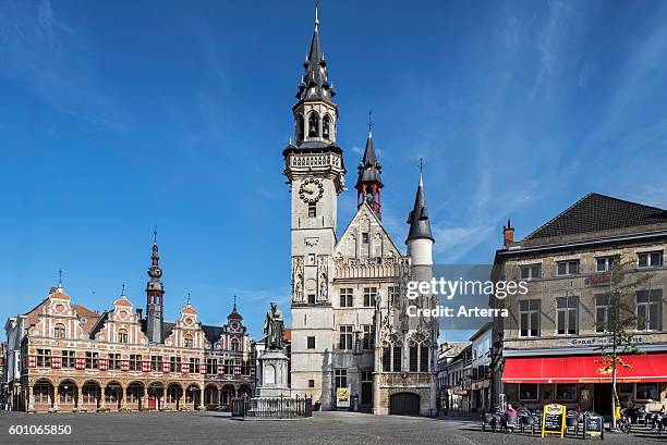 Borse of Amsterdam, belfry, Schepenhuis / Aldermen's House, former city hall and statue of the medieval printer Dirk Martens at the town square in...