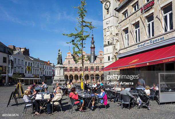 Elderly tourists at outdoor cafe on the town square in Aalst / Alost, East Flanders, Belgium.