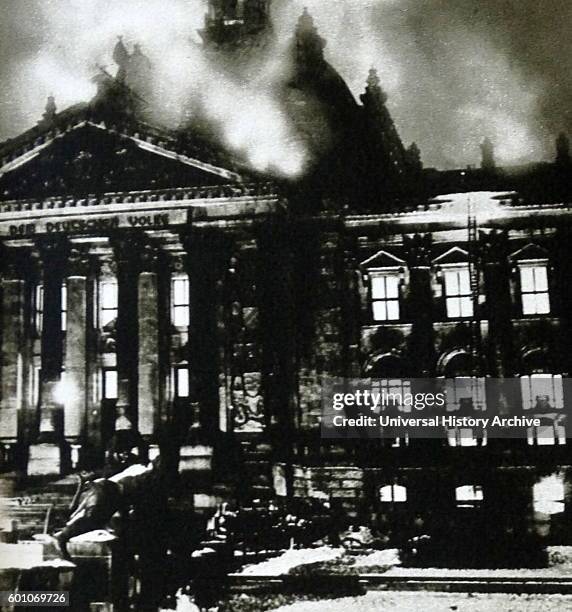 The Reichstag building on fire after an arson attack, Berlin, 27th February 1933. The event, which Adolf Hitler blamed on the Comintern at the time,...