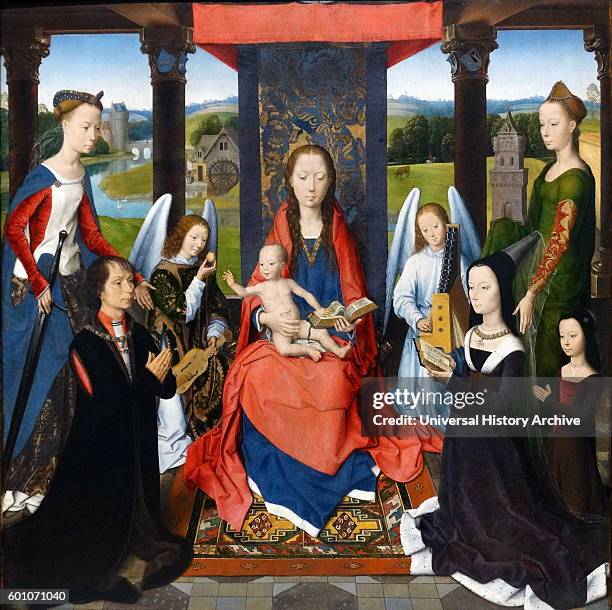 Triptych painting titled 'The Donne Triptych' by Hans Memling a German Early Netherlandish painter. Dated 15th Century.