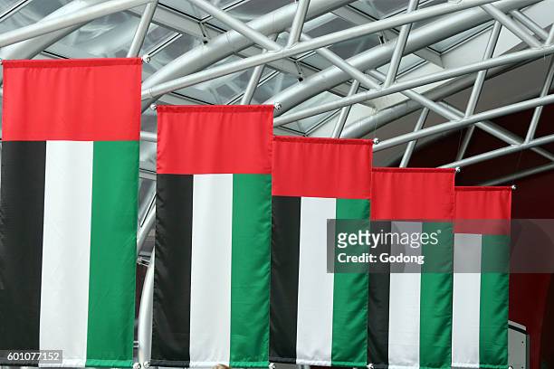 Yas Mall shopping centre on Yas Island in Abu Dhabi. Flags of the United Arab Emirates.