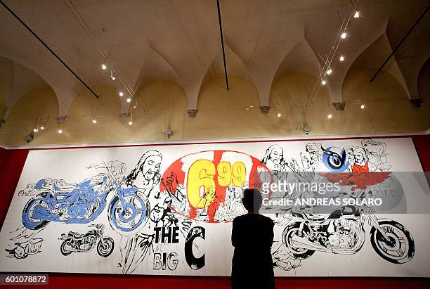 Visitor looks at a "The Last Supper" by US artist Andy Warhol during the exhibition "Repent and sin no more" at the Cloister of Bramante in Rome, 29...