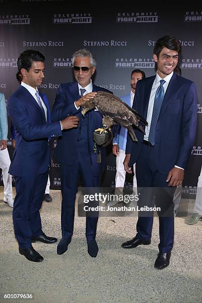 Amos, Andrea and Matteo Bocelli attend the Basilica di Santa Croce Dinner and Reception as part of Celebrity Fight Night Italy benefitting the Andrea...