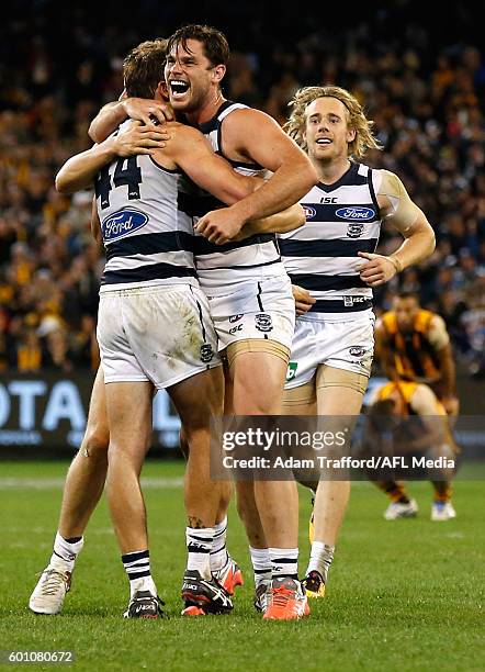 Cats players celebrate on the final siren during the 2016 AFL Second Qualifying Final match between the Geelong Cats and the Hawthorn Hawks at the...