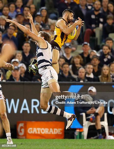 Paul Puopolo of the Hawks marks the ball during the 2016 AFL Second Qualifying Final match between the Geelong Cats and the Hawthorn Hawks at the...