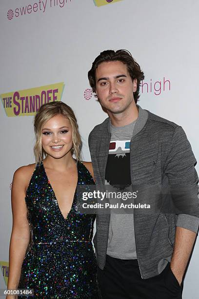 Actors Olivia Holt and Ryan McCartan attend the premiere of "The Standoff" at Regal LA Live: A Barco Innovation Center on September 8, 2016 in Los...