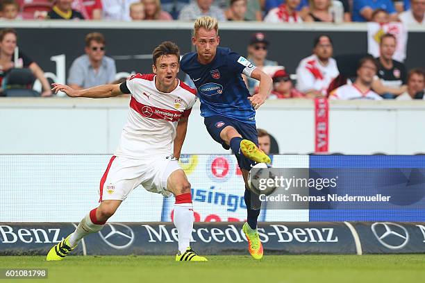 Christian Gentner of Stuttgart fights for the ball with Marc Schnatterer of Heidenheim during the Second Bundesliga match between VfB Stuttgart and...