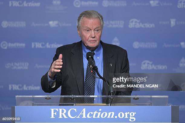 Actor Jon Voight speaks during the 11th annual Values Voter Summit at a hotel in Washington, DC on September 9, 2016. / AFP / MANDEL NGAN