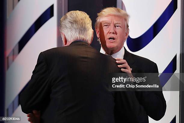 Republican presidential candidate Donald Trump embraces actor Jon Voight before addressing the Values Voter Summit at the Omni Shoreham September 9,...