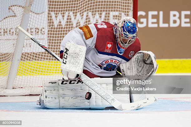 Alexander Tryanichev Goaltender of Yunost Minsk makes a save during the Champions Hockey League match between Vaxjo Lakers and Yunost Minsk at Vida...