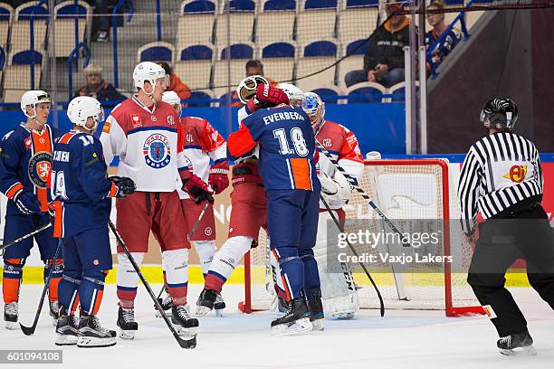 Dennis Everberg of Vaxjo Lakers face of with Sergei Sheleg of Yunost Minsk during the Champions Hockey League match between Vaxjo Lakers and Yunost...