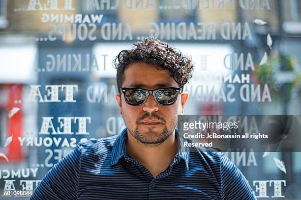 latin man with sunglasses - jc bonassin fotografías e imágenes de stock