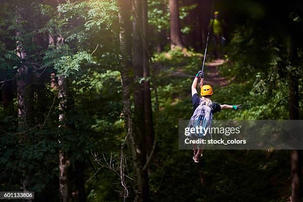 fun, adrenaline and adventure on the zip line - rappelling stock pictures, royalty-free photos & images