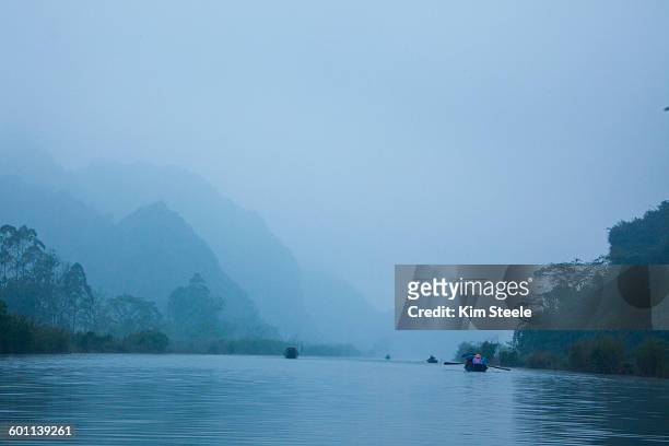 boats on day/red rivers to perfume pegoda, vietnam - red river stock pictures, royalty-free photos & images