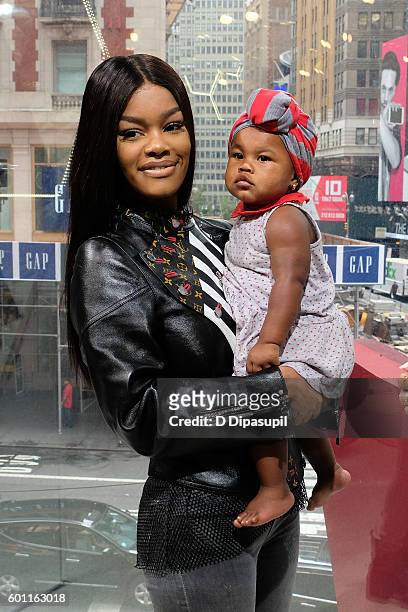 Teyana Taylor and daughter Iman "Junie" Shumpert visit "Extra" at their New York studios at H&M in Times Square on September 9, 2016 in New York City.