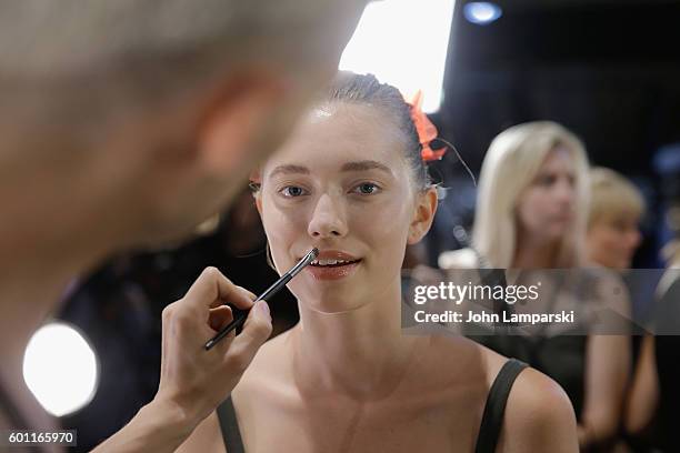 Models prepare backstage during the Milly Fashion Show during September 2016 New York Fashion Week at ArtBeam on September 9, 2016 in New York City.