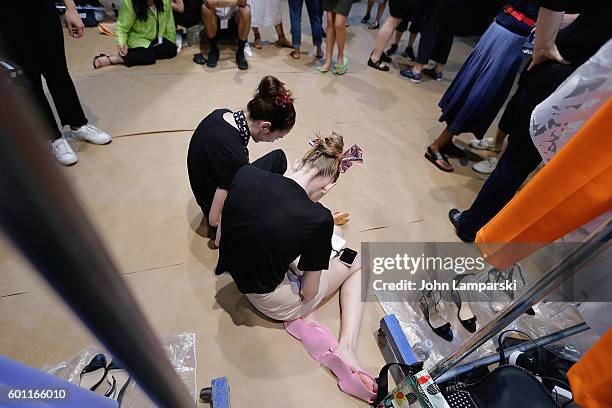 Models prepare backstage during the Milly Fashion Show during September 2016 New York Fashion Week at ArtBeam on September 9, 2016 in New York City.