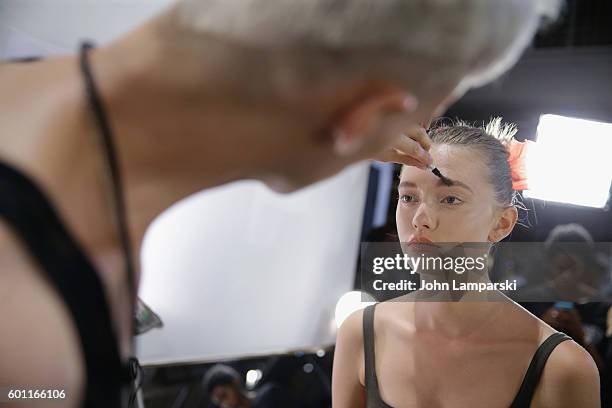 Models prepare backstage during the Milly Fashion Show during September 2016 New York Fashion Week at ArtBeam on September 9, 2016 in New York City.