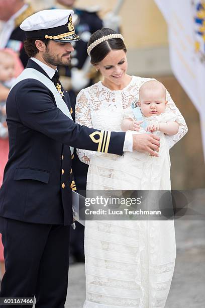 Prince Carl Philip, Princess Sofia and Prince Alexander attend the christening of Prince Alexander of Sweden at Drottningholm Palace Chapel on...