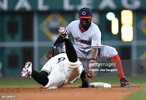 Gregory Polanco of the Pittsburgh Pirates is tagged out at second base by Brandon Phillips of the Cincinnati Reds during the second inning on...