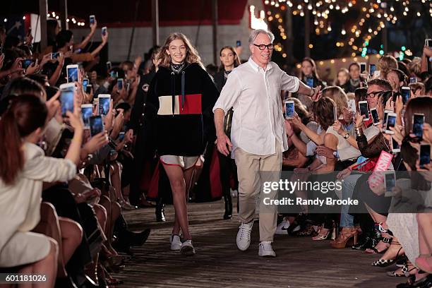 Model Gigi Hadid and designer Tommy Hilfiger walk the runway at #TOMMYNOW Women's Fashion Show during New York Fashion Week at Pier 16 on September...