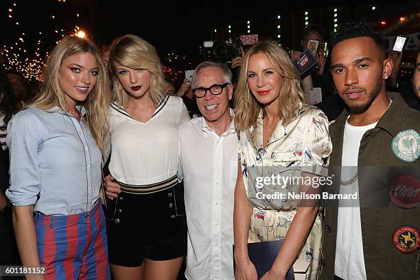 Martha Hunt, Taylor Swift, Tommy Hilfiger, Dee Hilfiger,and Lewis Hamilton attend the #TOMMYNOW Women's Fashion Show during New York Fashion Week at...