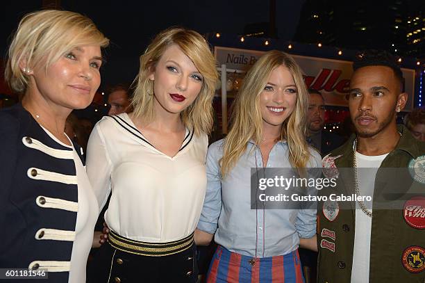 Yolanda Hadid, Taylor Swift, Martha Hunt, and Lewis Hamilton attend the #TOMMYNOW Women's Fashion Show during New York Fashion Week at Pier 16 on...