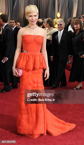 Portrait of actress Michelle Williams as she poses on the red carpet at the Hollywood & Highland Center Theatre during the 84th Academy Awards,...