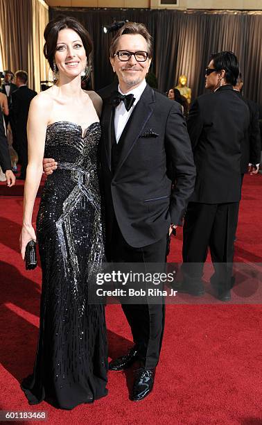 Portrait of married actors Alexandra Edenborough and Gary Oldman as they pose together on the red carpet at the Hollywood & Highland Center Theatre...