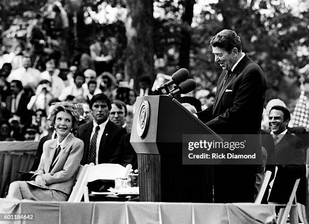 President Ronald Reagan addresses First Lady Nancy Reagan, Former President Jimmy Carter, Former First Lady Rosalynn Carter during the Carter Center...