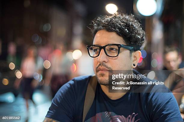 young man looking at the street - jc bonassin stock-fotos und bilder