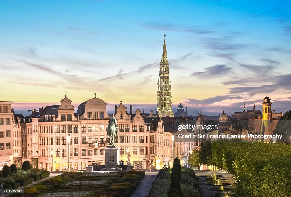 Brussels skyline at dusk with majestic City Hall bell tower in Gothic style illuminated with romantic sky, Brussels, Belgium