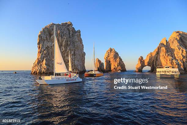 boats at land's end - baja california sur stock pictures, royalty-free photos & images