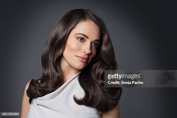 portrait of beautiful woman with long brunette hair - beauty stock pictures, royalty-free photos & images