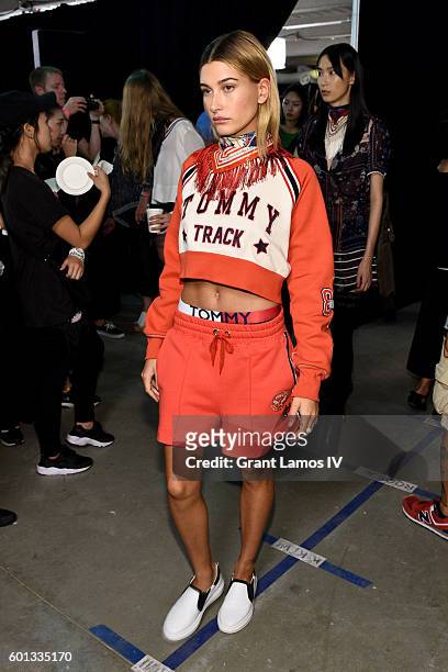 Model Hailey Baldwin prepares backstage at the #TOMMYNOW Women's Fashion Show during New York Fashion Week at Pier 16 on September 9, 2016 in New...