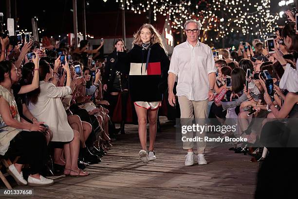 Model Gigi Hadid and designer Tommy Hilfiger walk the runway at #TOMMYNOW Women's Fashion Show during New York Fashion Week at Pier 16 on September...