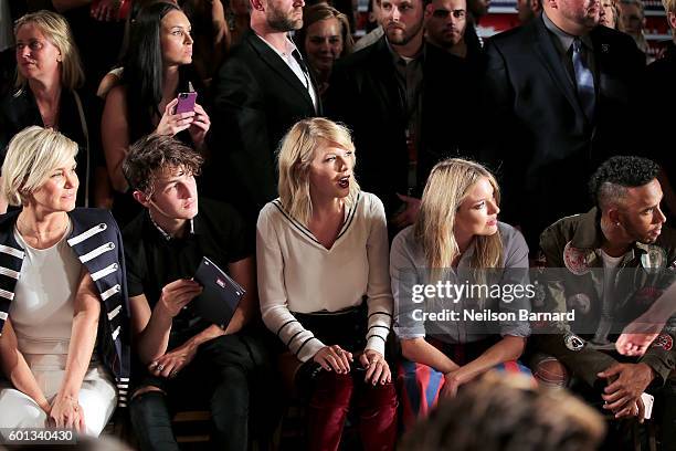 Yolanda Hadid, Anwar Hadid, Taylor Swift, Martha Hunt, and Lewis Hamilton attend the #TOMMYNOW Women's Fashion Show during New York Fashion Week at...