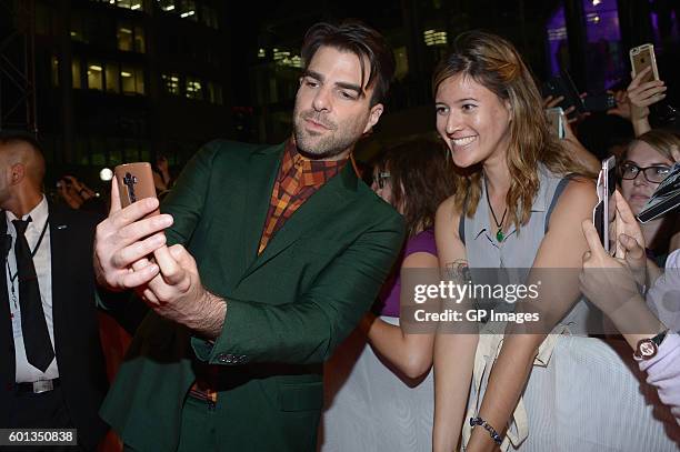 Actor Zachary Quinto takes a selfie with fans at the "Snowden" premiere during the 2016 Toronto International Film Festival at Roy Thomson Hall on...