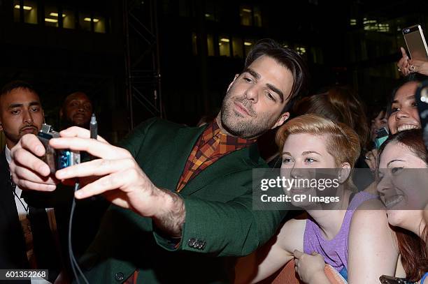 Actor Zachary Quinto takes a selfie with fans at the "Snowden" premiere during the 2016 Toronto International Film Festival at Roy Thomson Hall on...