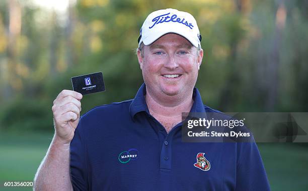 Brad Fritsch holds up his PGA tour card after the final round of the WinCo Foods Portland Open on August 28, 2016 in North Plains, Oregon.