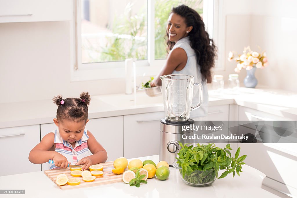 Helping mommy, making fresh lemonade.