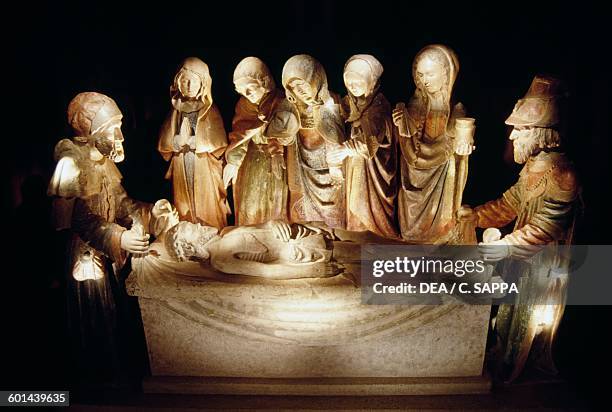 Deposition of Jesus in the tomb, polychrome sculpture in a chapel near Reygades cemetery, Limousin. France, 15th century.