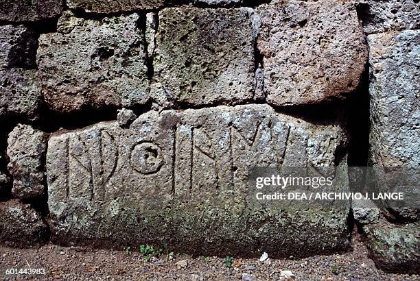 Inscription outside a tomb, Etruscan necropolis of the Crocifisso del Tufo, Orvieto, Umbria, Italy. Etruscan civilisation, 6th-5th century BC.